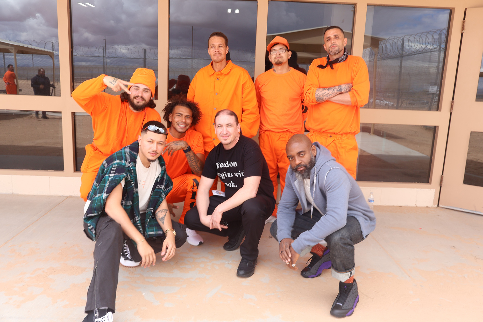 David (lower left), Freedom Reads Founder & CEO Reginald Dwayne Betts (lower right), and Freedom Reads Program Coordinator Steven Parkhurst (lower middle) with men at Arizona State Prison Complex - Yuma.