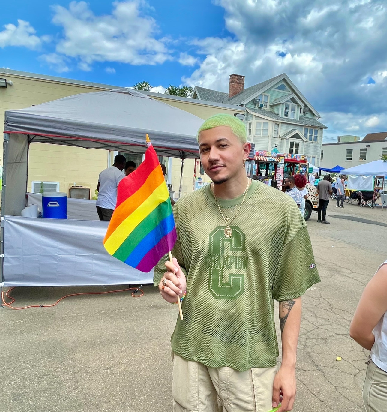 Freedom Reads Library Coordinator David Perez Jr holds a Pride flag