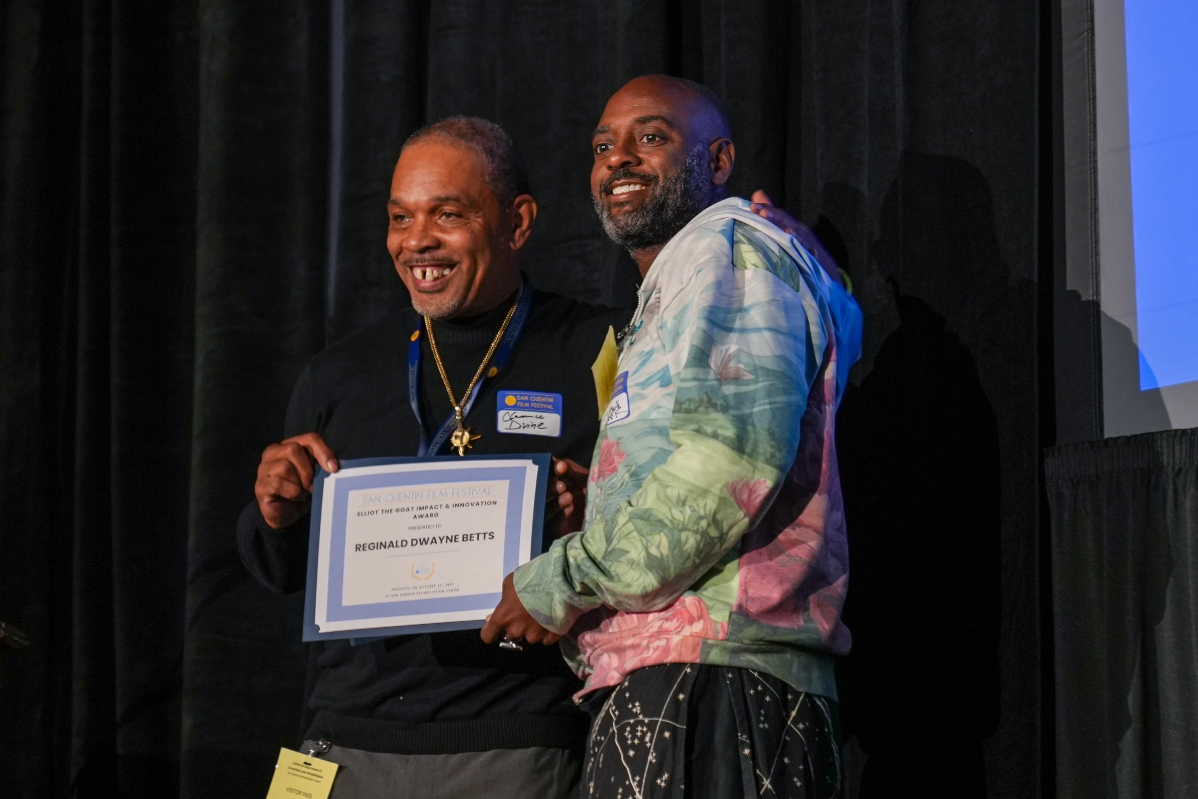 Freedom Reads Founder & CEO, Reginald Dwayne Betts receiving the Elliot the G.O.A.T Award at the San Quentin Film Festival. (Source: CDCR OPEC)
