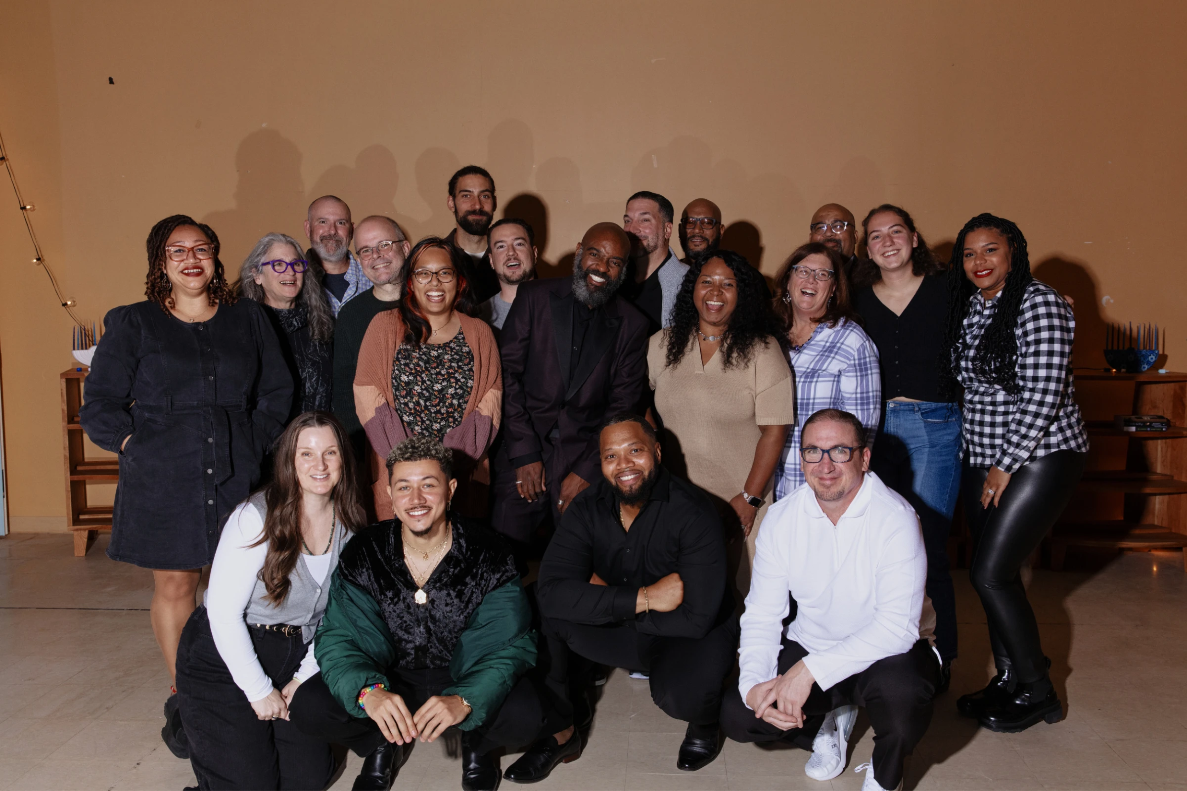 The Freedom Reads team (19 people) pose for a photo, smiling.